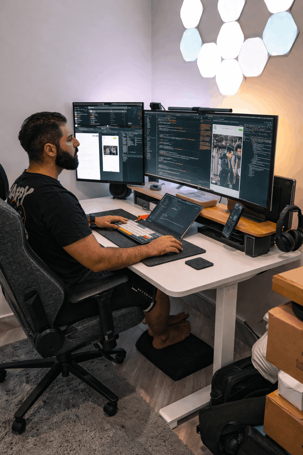 Developer working at multiple monitors